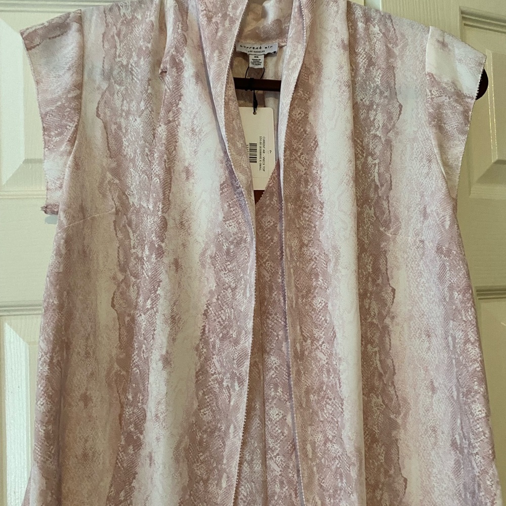 White with light pink snakeskin blouse